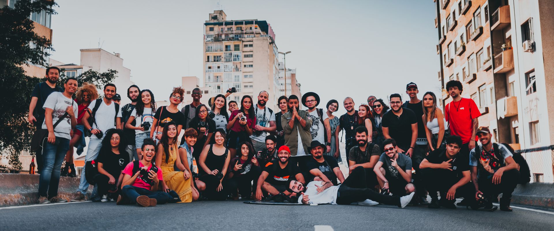 A diverse community group standing together and smiling