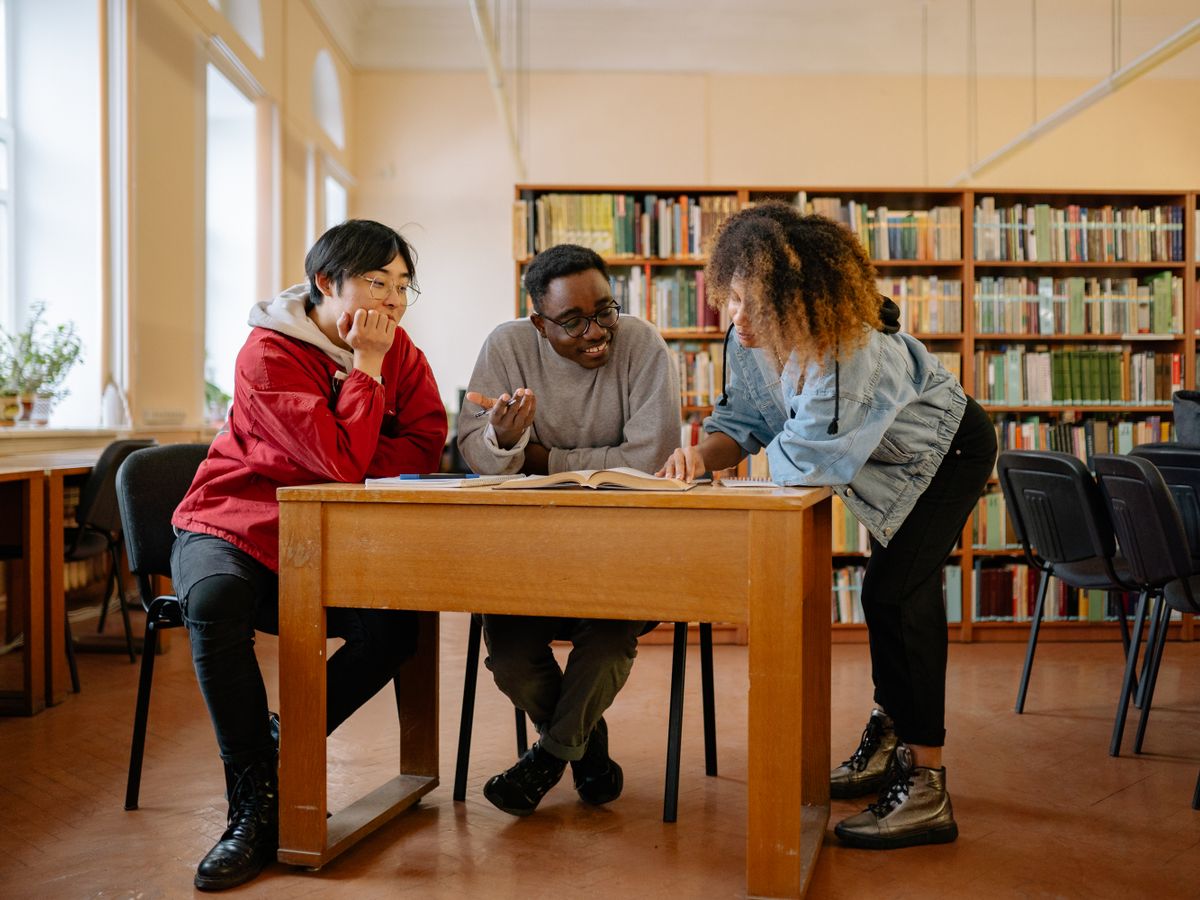 Students collaborating around a table during a workshop