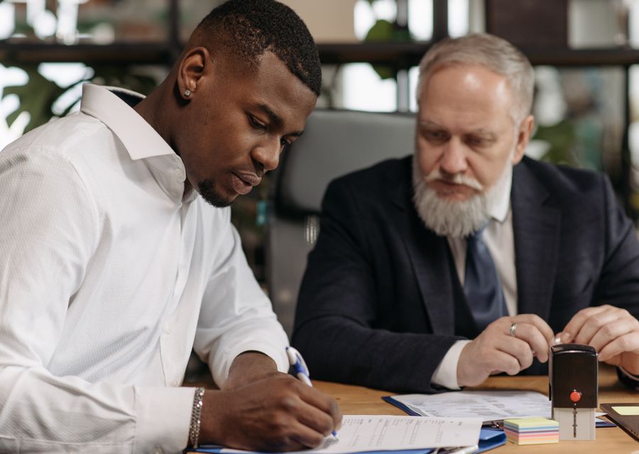 A mentor talking with a young adult