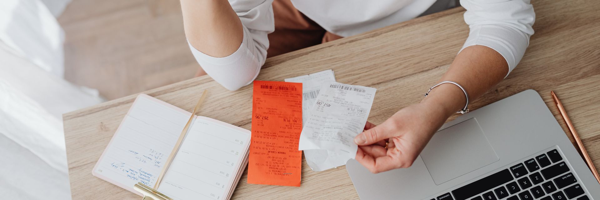 A household budget and savings plan laid out on a desk