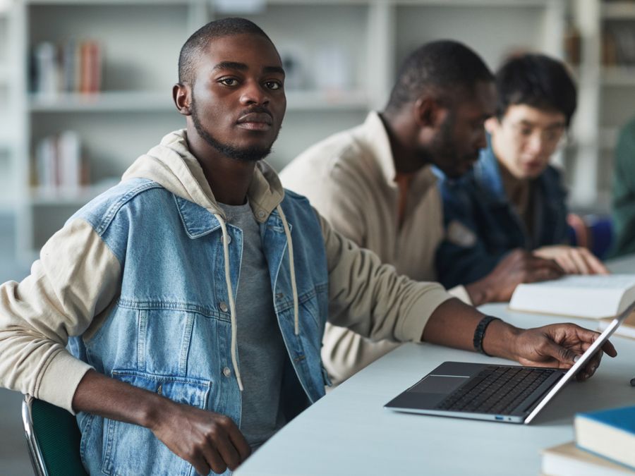Young people studying together with a laptop