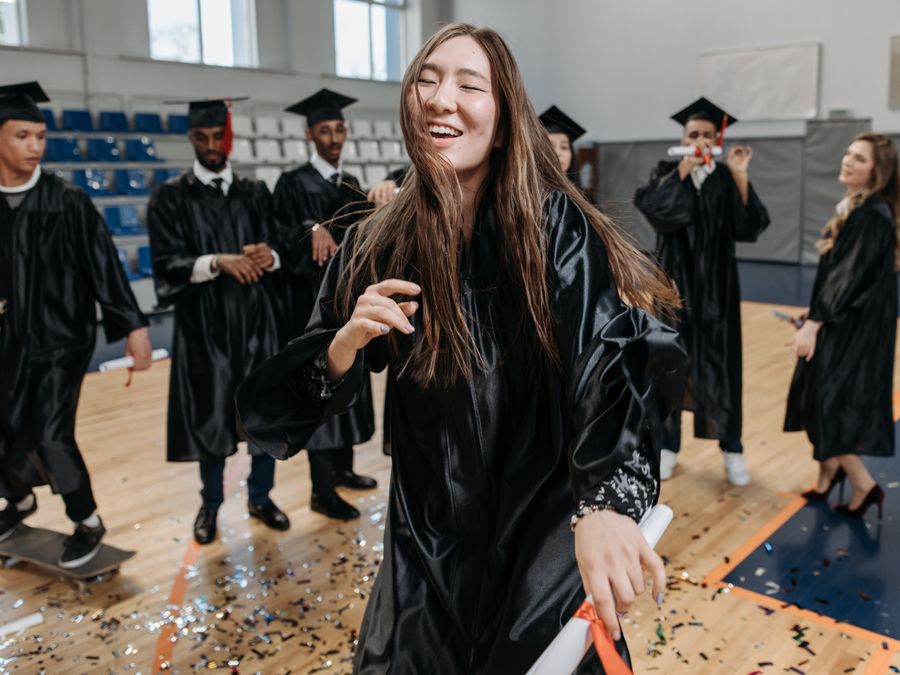 Students celebrating a graduation milestone