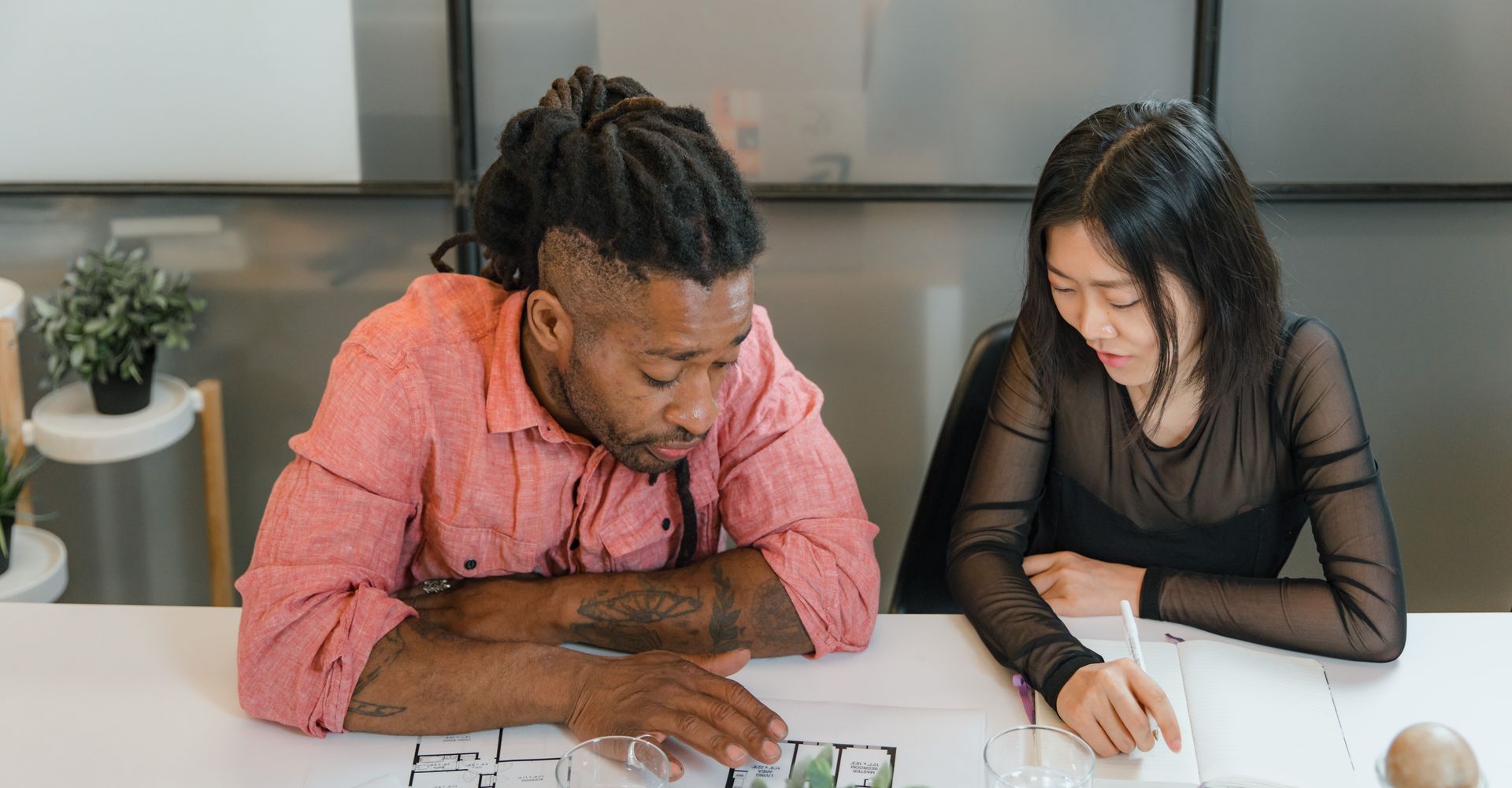 Young professionals working together around a table in a bright office