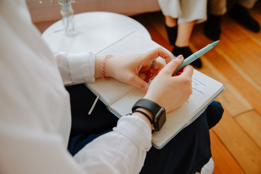 A coaching session with notes and goals on the table